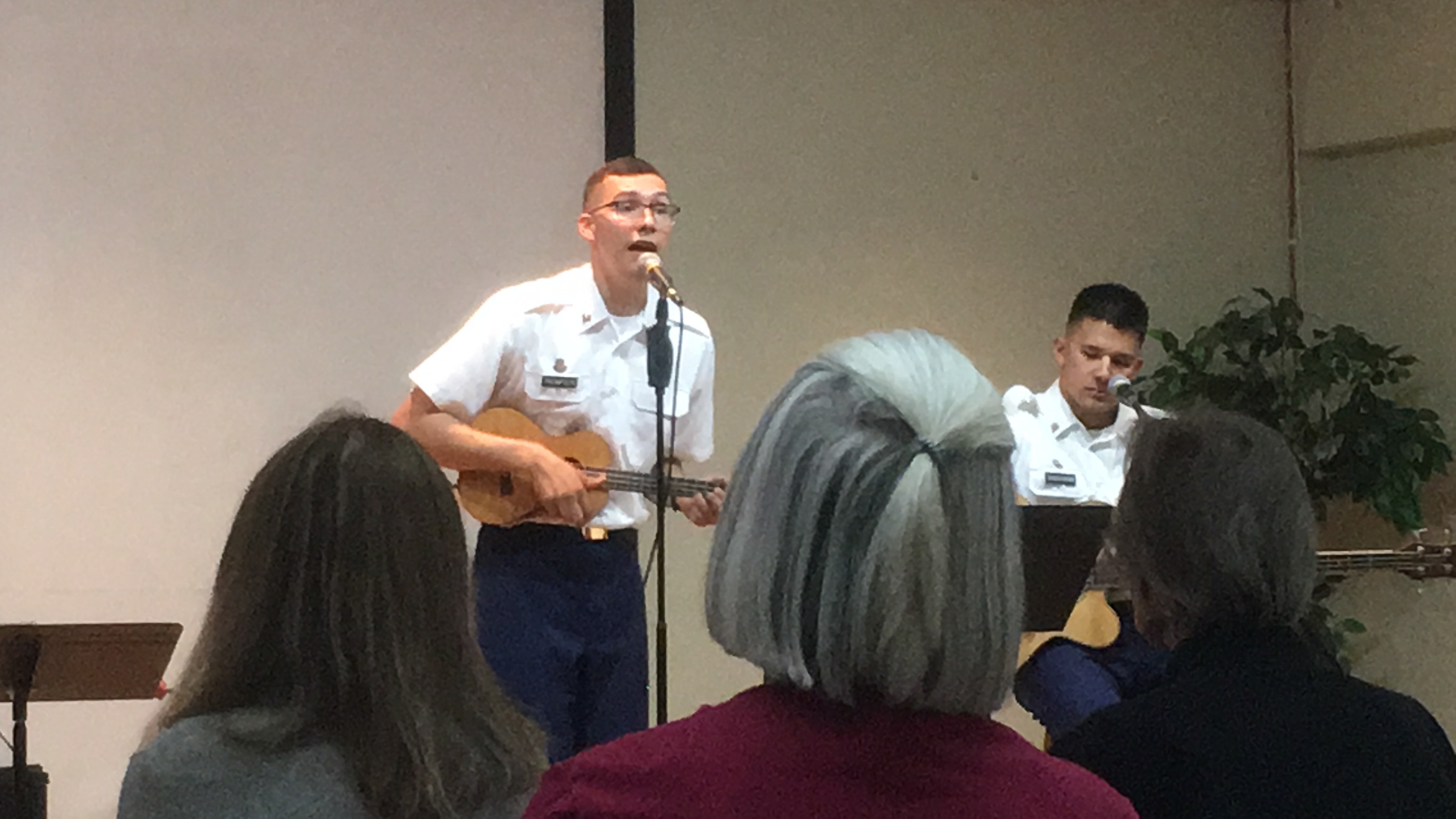 Army bandsman singing and playing ukelele at the Ethel Berger Center